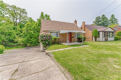 Double-wide cement driveway and covered front patio.