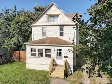 Front of house with roof with shingles