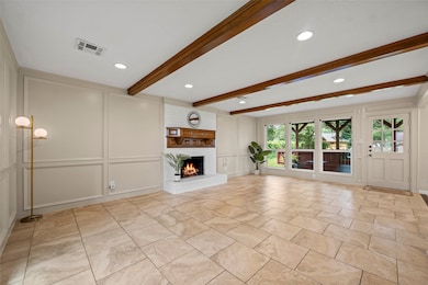 Living space is anchored by a cozy gas fireplace.