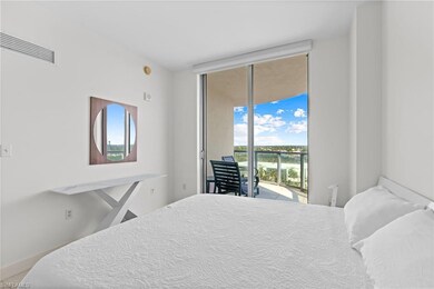 Bedroom with access to outside, expansive windows, and baseboards