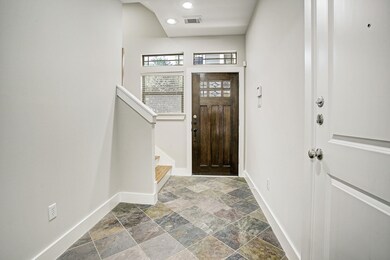 Foyer has Brazilian slate floors and has entrance