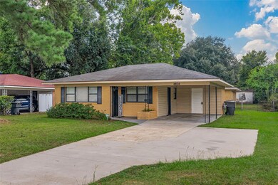 Single story home with a front lawn