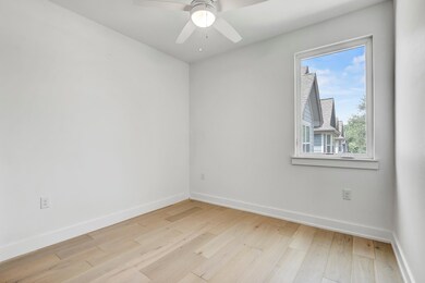 Empty room featuring light wood finished floors a