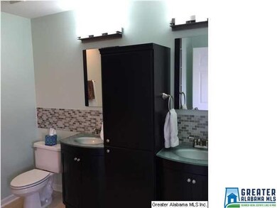 Remodeled Bath with new cabinets, tile backsplash,