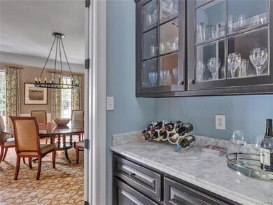 Butlers Pantry with upper glass cabinets.