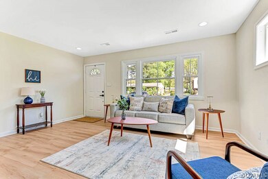 Living room with light hardwood / wood-style flooring