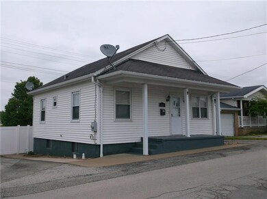 It features an attached garage and also extra pave