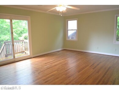 Master Bedroom. Master Bedroom with more gleaming hardwoods.  Notice the small deck off of this room...the perfect spot for your morning coffee.