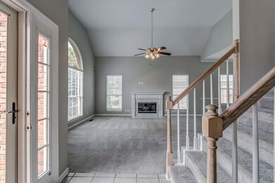 Spacious Family Room with gas fireplace is positioned off of entry.