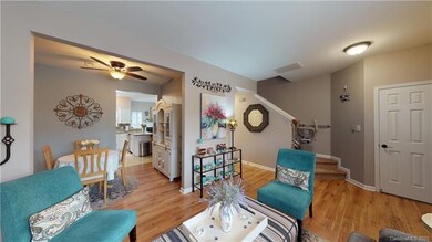 Living room showing formal dining area and stairs.