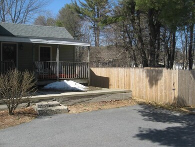 Porch with fenced in back yard.