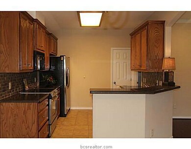 Kitchen. Nice eating bar to keep the conversation