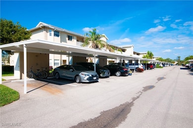 View of car parking featuring a carport