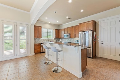 Kitchen with stainless steel appliances, a kitche