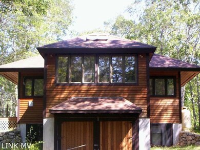 Rear of studio with garage underneath