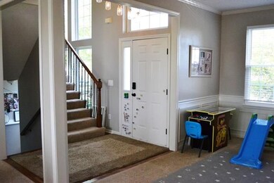 Dramatic stairway with 2 story windows