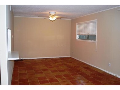 Family Room/Den with Mexican Tile and Sliding Door