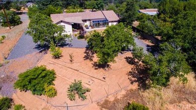 The property includes the gravel access on the lef