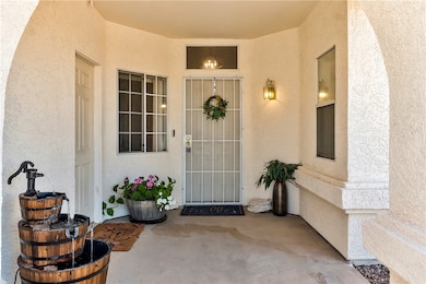 Doorway to property featuring stucco siding and a