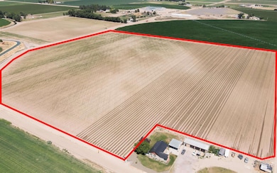 Overview of rural landscape featuring property boundaries highlighted and large plots for crops