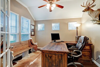 Enter into the light & airy home office through a beautiful set of French doors.  This space can accommodate a variety of furniture arrangements. Note the high ceilings.