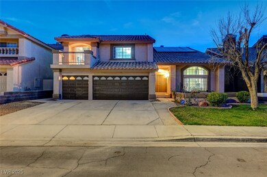 Mediterranean / spanish-style home featuring a gar