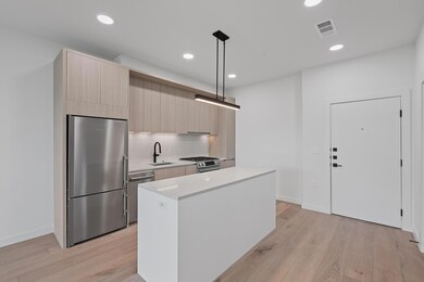 Kitchen featuring appliances with stainless steel