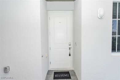 Property entrance with stucco siding