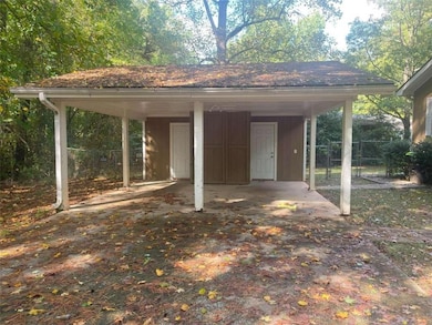 View of outdoor structure featuring a carport
