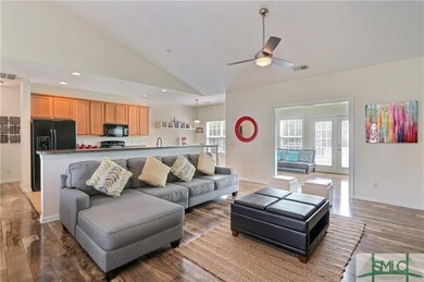 Spacious great room with wood floors