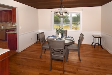 Opening to the living room, this dining room easily adapts for larger groups.