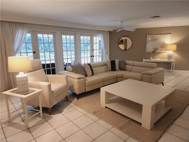 Living room with light tile patterned floors, visi