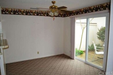The dining area has a bar to the Kitchen as well a