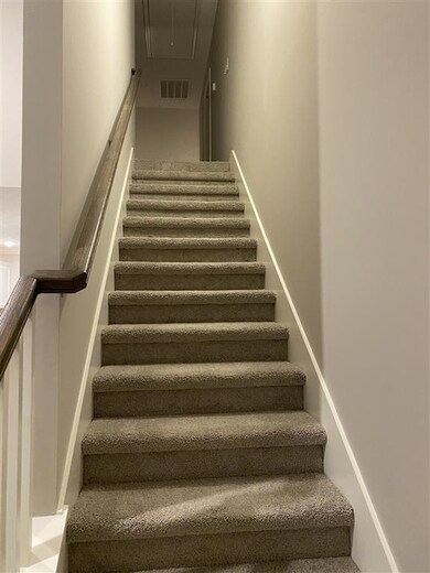 View from breakfast room, stairs with spindles lea