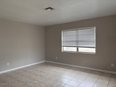 Spare room with light tile patterned floors