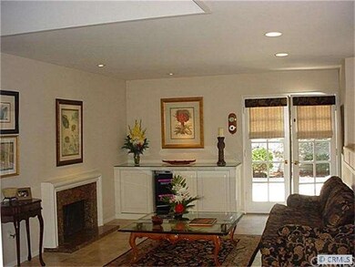 Spacious Living Area with Custom Built-ins and Fre