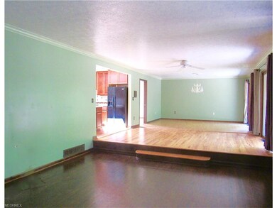 Sunken living room walks up to kitchen/dining spac