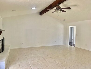 Unfurnished living room featuring light tile patte