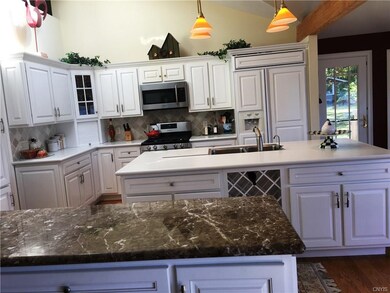 Kitchen features a large center island and generou