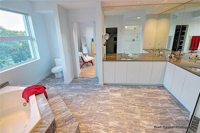Luxurious master bath with marble floors and large