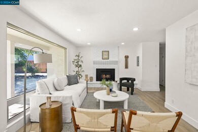 OPEN LIVING ROOM -Brick fireplace with insert adds warmth and ambiance on chilly evenings