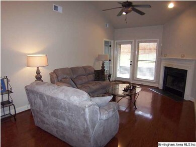 Great room with stone fireplace and high ceilings!