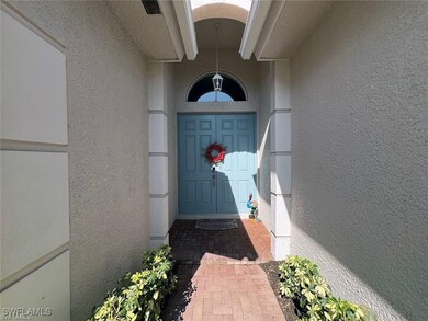 View of exterior entry with stucco siding