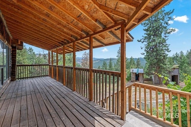Wooden terrace featuring a mountain view