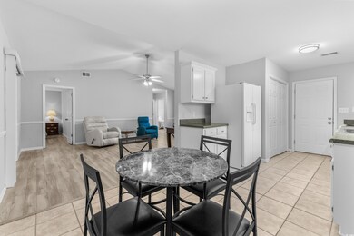Dining room with ceiling fan, light hardwood / woo