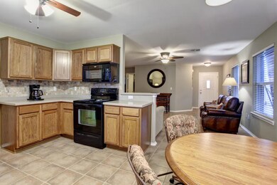 Kitchen looking back to living and entry...