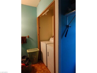 Main floor laundry and closet area in bathroom
