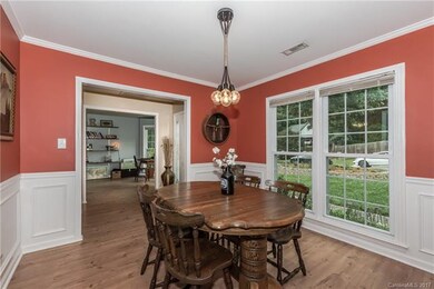 Stylish formal dining room with new laminate wood 