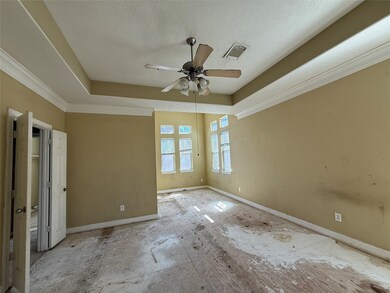 Primary bedroom features large windows for ample n