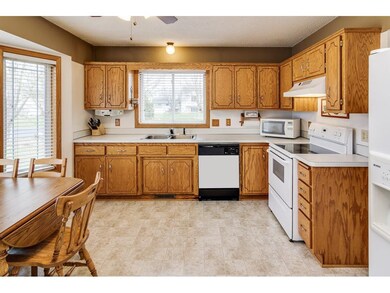 Large eat in kitchen is very clean and bright.